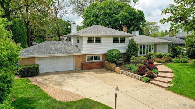 2663 Southcrest Dr, Downers Grove, IL 60516 - split level home featuring driveway, an attached garage, a chimney, and brick siding