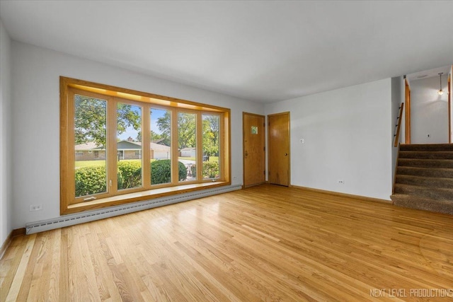 2663 Southcrest Dr, Downers Grove, IL 60516 - empty room with a baseboard radiator, light wood-style floors, stairway, and baseboards