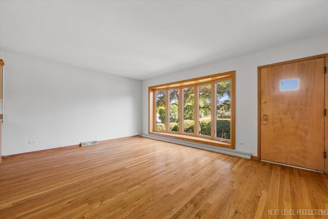 2663 Southcrest Dr, Downers Grove, IL 60516 - unfurnished living room featuring a baseboard heating unit and light wood finished floors