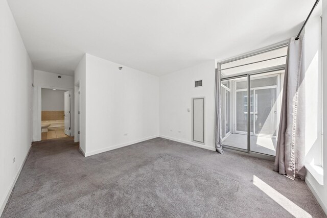 1250 S Michigan Ave Unit 1502, Chicago, IL 60605 - carpeted empty room featuring baseboards