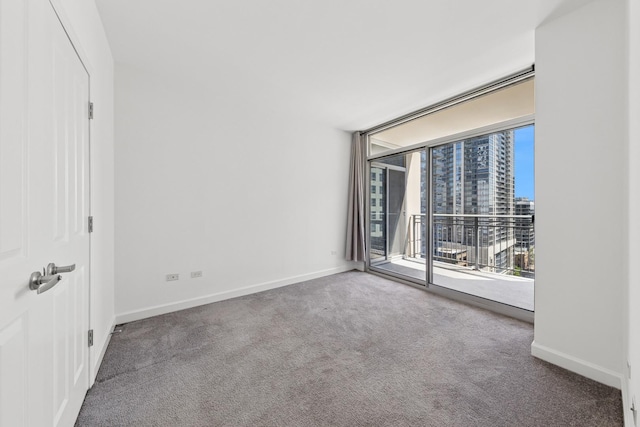 1250 S Michigan Ave Unit 1502, Chicago, IL 60605 - carpeted empty room featuring baseboards and a city view