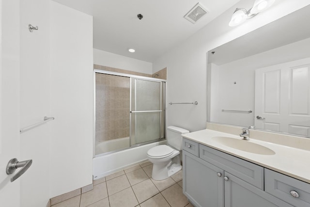 1250 S Michigan Ave Unit 1502, Chicago, IL 60605 - bathroom with tile patterned flooring, toilet, vanity, and bath / shower combo with glass door