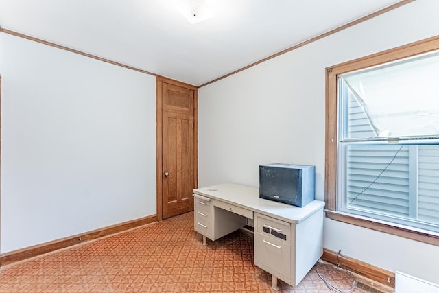 unfurnished office featuring baseboards and ornamental molding