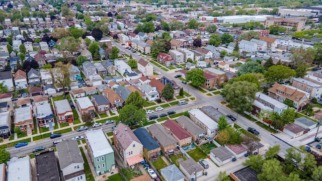 aerial view of property and surrounding area with nearby suburban area