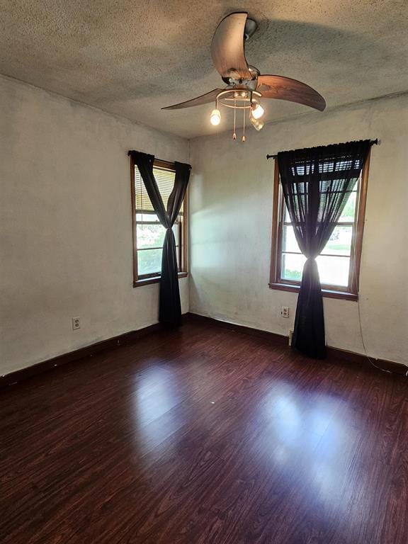 506 S 8th St, Oregon, IL 61061 - spare room featuring ceiling fan, healthy amount of natural light, wood finished floors, a textured ceiling, and baseboards