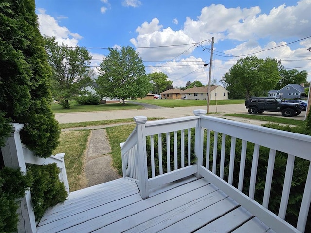 506 S 8th St, Oregon, IL 61061 - deck featuring covered porch and a residential view