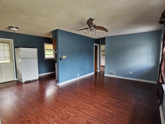 506 S 8th St, Oregon, IL 61061 - empty room featuring a textured ceiling, a ceiling fan, wood finished floors, and baseboards