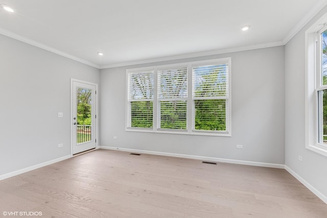 2508 Weatherbee Ln, Naperville, IL 60563 - empty room with crown molding, healthy amount of natural light, light wood-style floors, baseboards, and recessed lighting