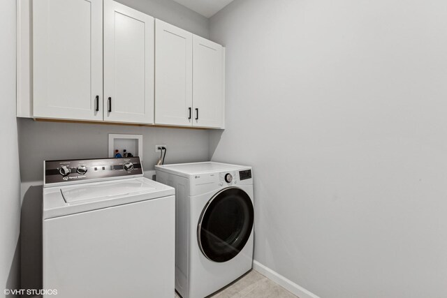 2508 Weatherbee Ln, Naperville, IL 60563 - laundry room with cabinet space, separate washer and dryer, and baseboards
