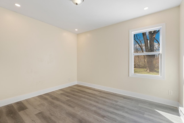292 W 17th St, Chicago Heights, IL 60411 - unfurnished room featuring wood finished floors, baseboards, and recessed lighting