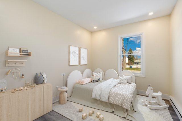 292 W 17th St, Chicago Heights, IL 60411 - bedroom featuring a baseboard heating unit, recessed lighting, and baseboards