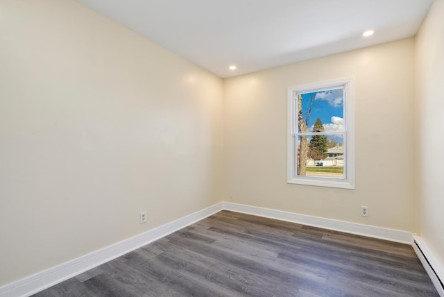 292 W 17th St, Chicago Heights, IL 60411 - empty room featuring baseboard heating, dark wood-style floors, baseboards, and recessed lighting