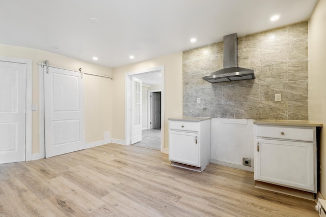 292 W 17th St, Chicago Heights, IL 60411 - kitchen featuring wall chimney range hood, white cabinetry, light wood-style floors, recessed lighting, and light countertops