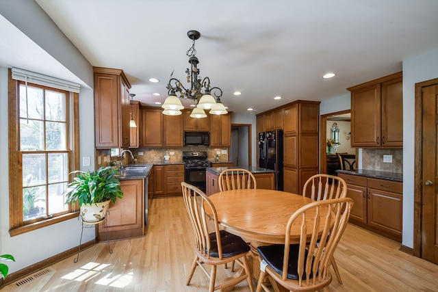1628 Westminster Dr, Naperville, IL 60563 - dining space with light wood finished floors, a chandelier, baseboards, and recessed lighting