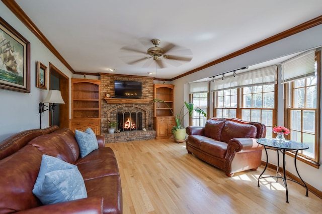 1628 Westminster Dr, Naperville, IL 60563 - living area with light wood-style flooring, crown molding, ceiling fan, a fireplace, and baseboards