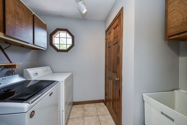1628 Westminster Dr, Naperville, IL 60563 - washroom with cabinet space, washing machine and dryer, light tile patterned floors, and baseboards