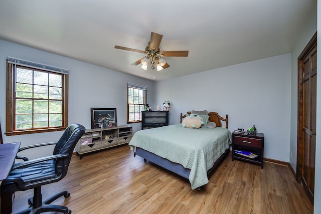 1628 Westminster Dr, Naperville, IL 60563 - bedroom featuring wood finished floors, a desk, a closet, a ceiling fan, and baseboards