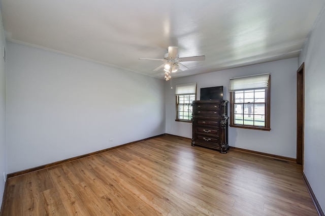 1628 Westminster Dr, Naperville, IL 60563 - spare room featuring a ceiling fan, baseboards, and wood finished floors