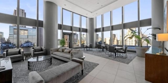 common area with a high ceiling and a view of skyline