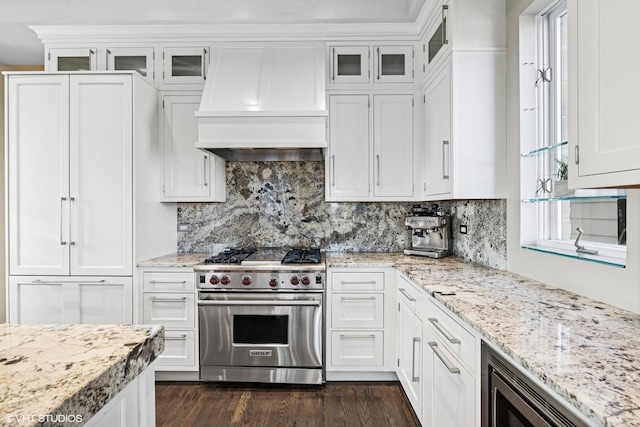1625 W Barry Ave Unit 3, Chicago, IL 60657 - kitchen with designer stove, white cabinets, dark wood finished floors, premium range hood, and glass insert cabinets