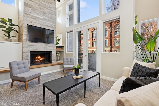 1625 W Barry Ave Unit 3, Chicago, IL 60657 - living area featuring carpet floors, baseboards, a high end fireplace, and a high ceiling
