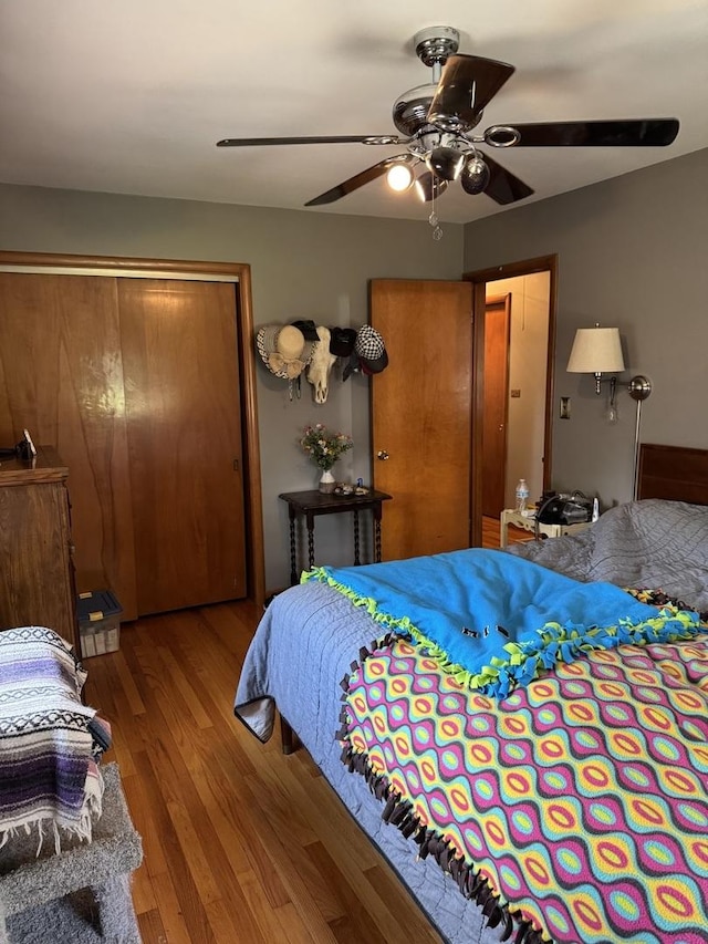 bedroom with wood finished floors and ceiling fan