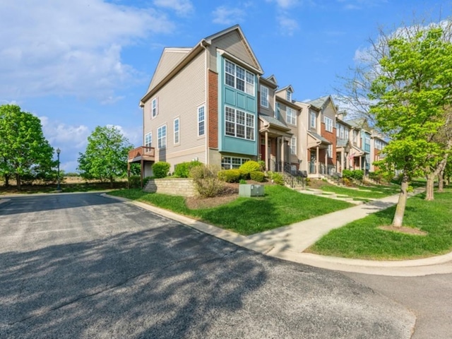 view of side of property with a residential view
