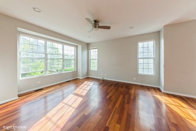 unfurnished room with baseboards, wood finished floors, a ceiling fan, and recessed lighting