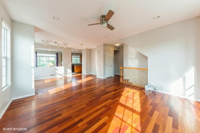 unfurnished living room featuring wood finished floors, ceiling fan, baseboards, and recessed lighting