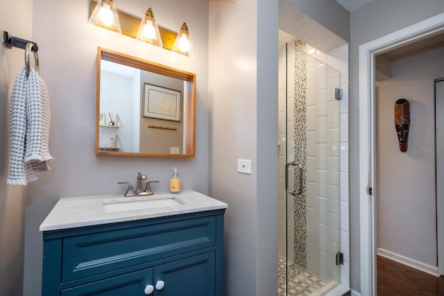 18450 W Streamwood Ct, Gurnee, IL 60031 - full bathroom with vanity, a shower stall, wood finished floors, and baseboards