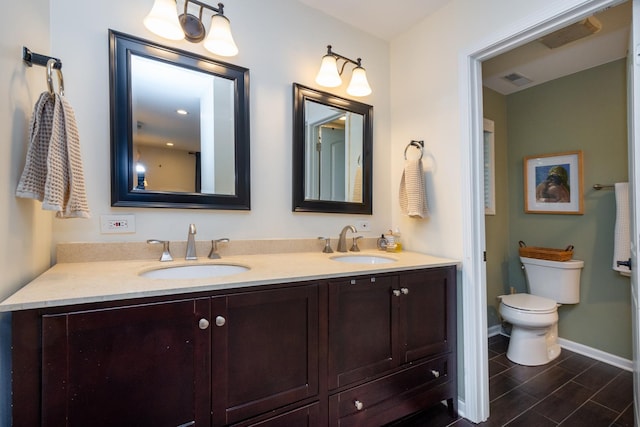 18450 W Streamwood Ct, Gurnee, IL 60031 - bathroom with double vanity, toilet, and baseboards