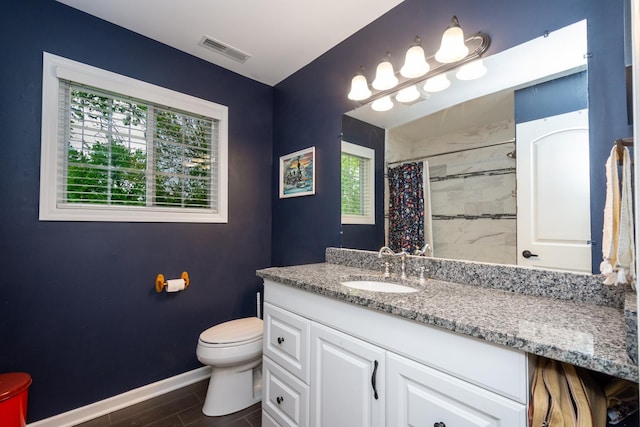 18450 W Streamwood Ct, Gurnee, IL 60031 - full bathroom featuring toilet, vanity, baseboards, and a shower with shower curtain