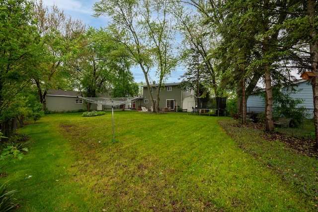 18450 W Streamwood Ct, Gurnee, IL 60031 - view of grassy yard with a trampoline