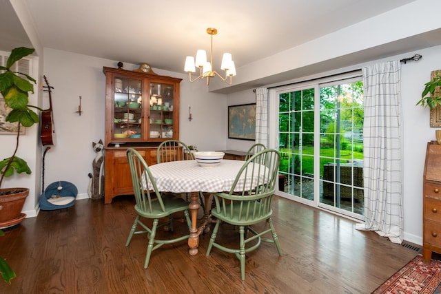 18450 W Streamwood Ct, Gurnee, IL 60031 - dining space with a chandelier, wood finished floors, and baseboards