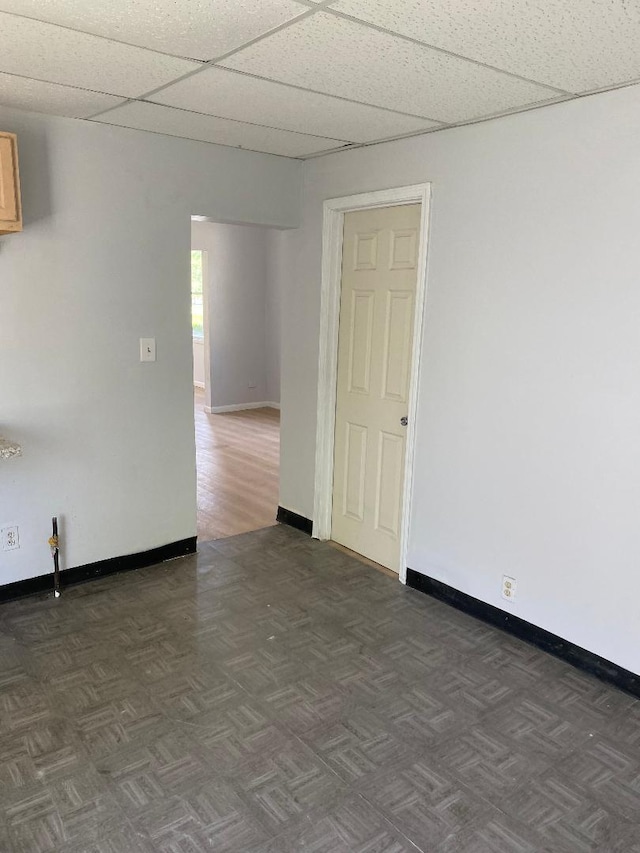 11809 S Lafayette Ave, Chicago, IL 60628 - empty room with baseboards and a paneled ceiling