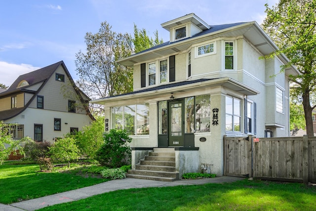 traditional style home featuring stucco siding