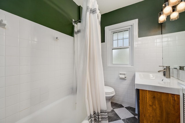 full bathroom featuring tile walls, toilet, vanity, and shower / bath combination with curtain