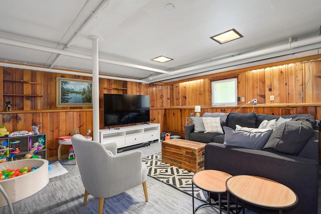 living room featuring wooden walls and wood finished floors
