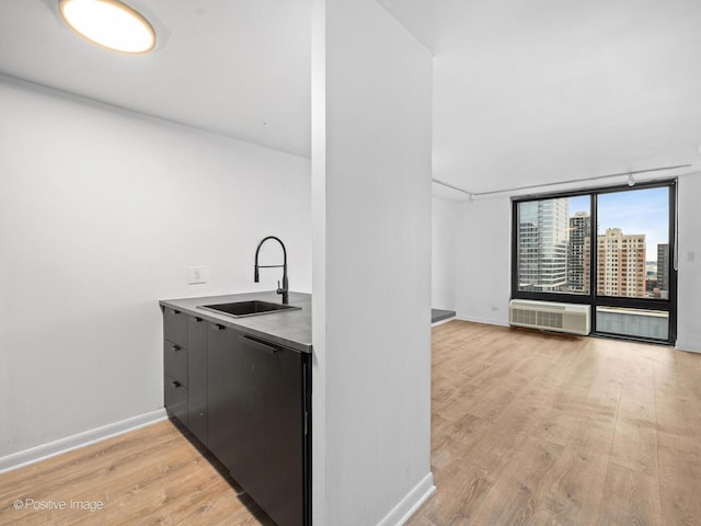 1221 N Dearborn St Unit 1401S, Chicago, IL 60610 - kitchen featuring a sink, light wood finished floors, refrigerator, baseboards, and a city view