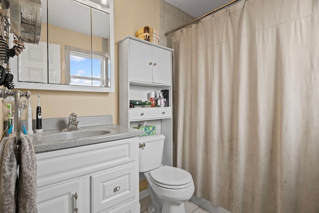 bathroom with vanity, toilet, tile patterned floors, and a shower with curtain