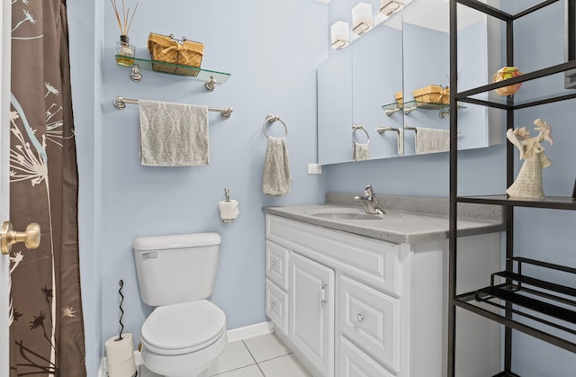 full bath with toilet, tile patterned flooring, vanity, and baseboards