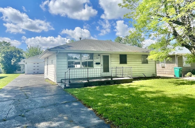 2445 E Wood St, Decatur, IL 62521 - bungalow-style house featuring a front lawn and asphalt driveway
