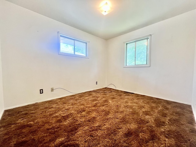 2445 E Wood St, Decatur, IL 62521 - carpeted empty room with baseboards