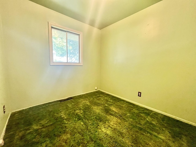 2445 E Wood St, Decatur, IL 62521 - empty room featuring dark carpet and baseboards
