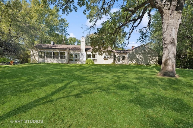 16937 W Jonathan Ln, Gurnee, IL 60031 - back of property with a yard and a chimney