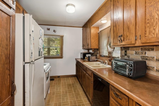 16937 W Jonathan Ln, Gurnee, IL 60031 - kitchen with a sink, white appliances, baseboards, brick patterned flooring, and brown cabinets