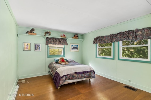 16937 W Jonathan Ln, Gurnee, IL 60031 - bedroom featuring ornamental molding, wood finished floors, and baseboards