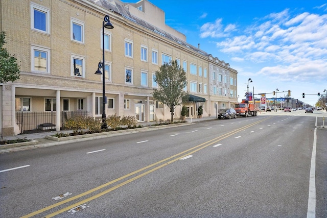 6337 Roosevelt Rd Unit 209, Berwyn, IL 60402 - view of asphalt road featuring sidewalks, curbs, street lights, and traffic lights