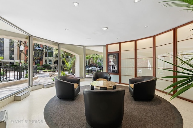 building lobby featuring expansive windows and recessed lighting