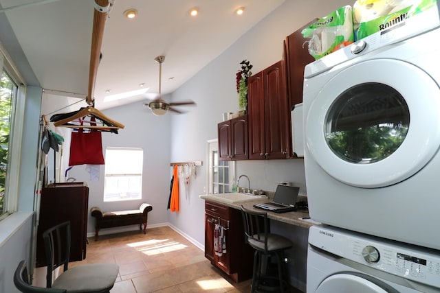 2210 Sandburg Dr, Aurora, IL 60506 - laundry area featuring stacked washer / drying machine, healthy amount of natural light, a ceiling fan, light tile patterned flooring, and recessed lighting